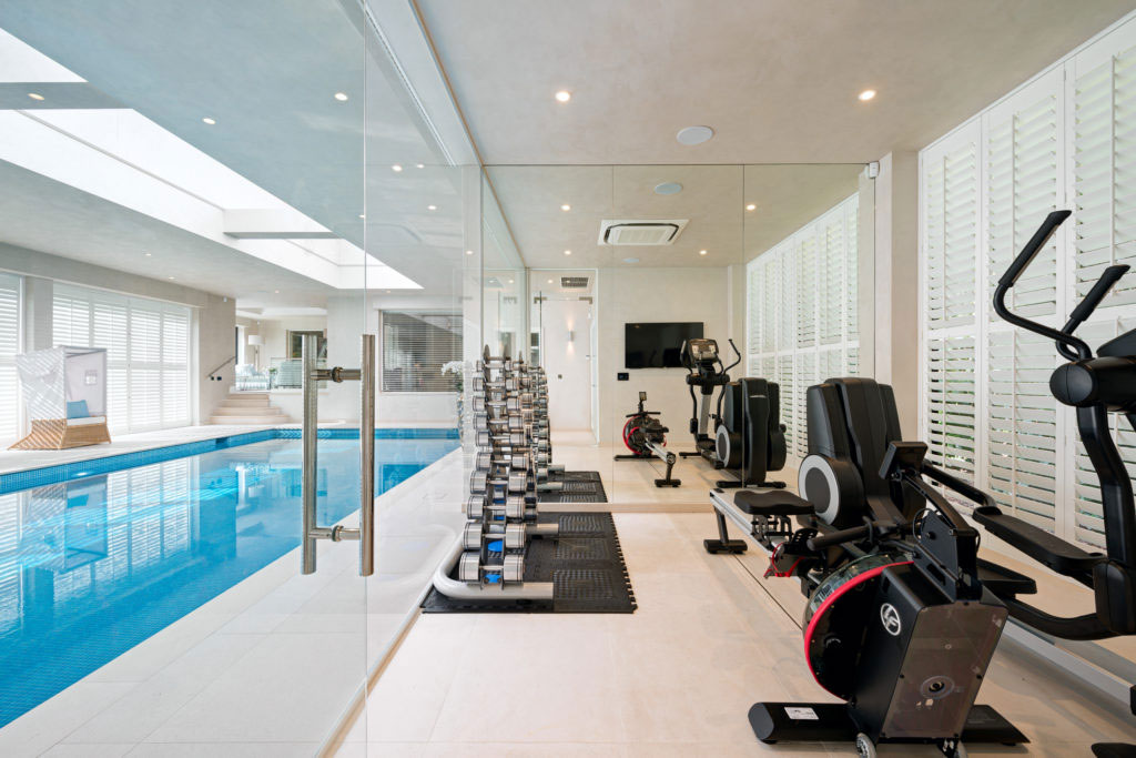 Gym and pool wellness facility design for Surrey home