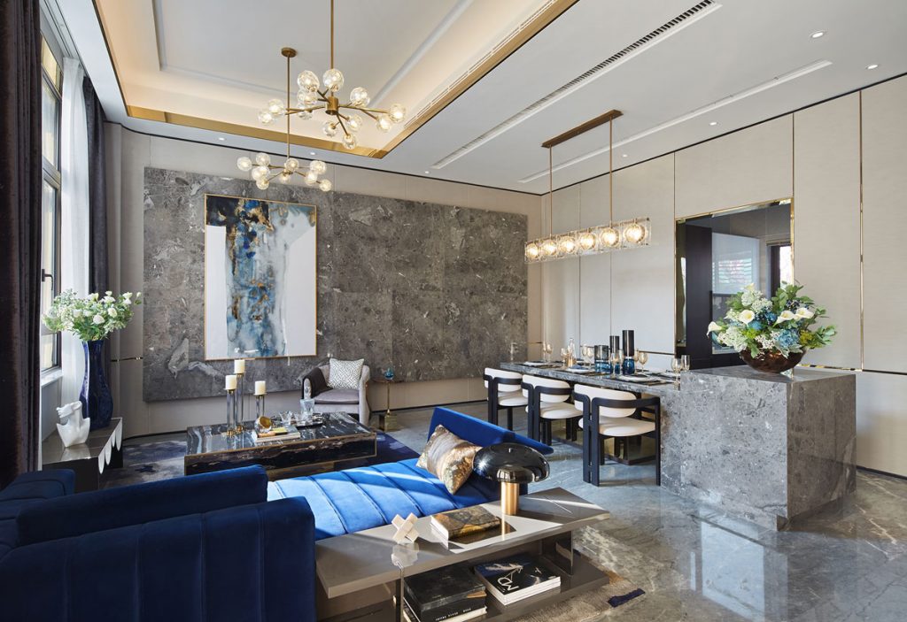 Living area interior design featuring marble flooring and blue sofa