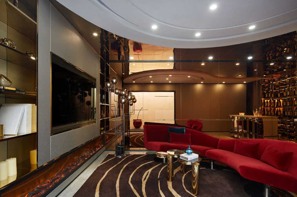 Luxury cinema room with red contemporary sofa and atmospheric lighting