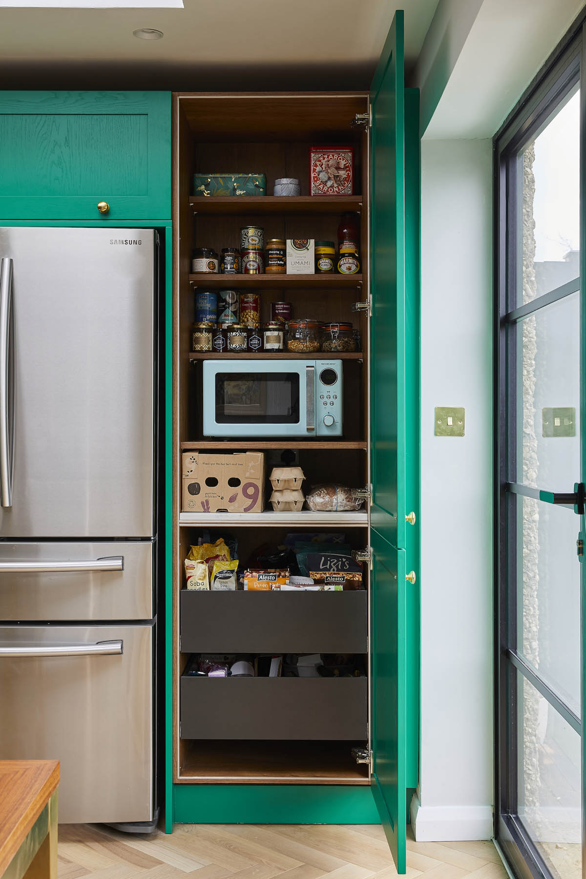 bold open space design, Tired Kitchen, Dining and Living Areas are United in a Bold Open Plan Space